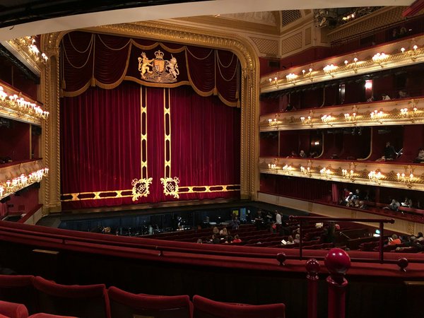 How can you arrange a behind-the-scenes tour of the Royal Opera House in London?